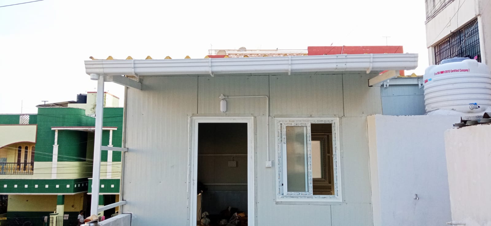 PUF prefabricated portable cabin installed by Arasuvel Roofings for site office and modular building